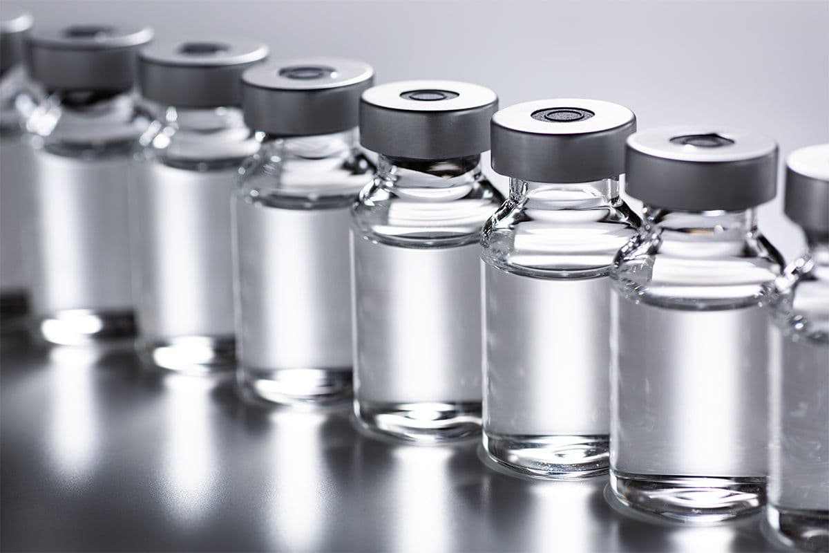 Laboratory vials of research peptides on a clean surface